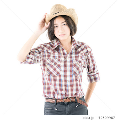Young woman in a cowboy hat and plaid shirt with 59609987