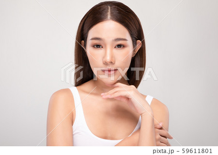 Beautiful Asian young woman holding hands smile with clean and fresh skin Happiness and cheerful with positive emotional,isolated on gray background,Beauty and Cosmetics Concept Beautiful Asian young woman holding hands smile with clean and fresh skin Happiness and cheerful with positive emotional,isolated on gray background,Beauty and Cosmetics Concept 59611801