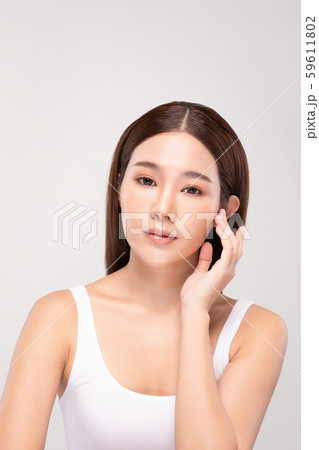 Beautiful Asian young woman holding hands smile with clean and fresh skin Happiness and cheerful with positive emotional,isolated on gray background,Beauty and Cosmetics Concept Beautiful Asian young woman holding hands smile with clean and fresh skin Happiness and cheerful with positive emotional,isolated on gray background,Beauty and Cosmetics Concept 59611802