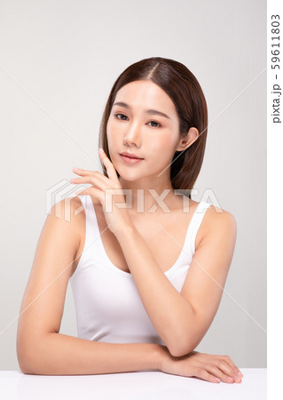 Beautiful Asian young woman holding hands smile with clean and fresh skin Happiness and cheerful with positive emotional,isolated on gray background,Beauty and Cosmetics Concept 59611803
