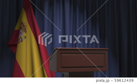 National flag of Spain and speaker podium tribune. Political event or statement related conceptual 59612439