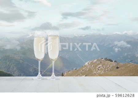 Champagne in glasses and landscape of mountains on background 59612628