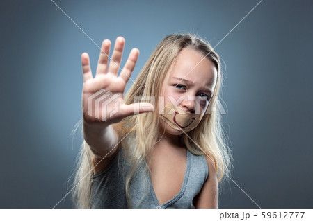 Sad and frightened little girl with bloodshot and bruised eyes, fiction of happiness Sad and frightened little girl with bloodshot and bruised eyes, fiction of happiness 59612777