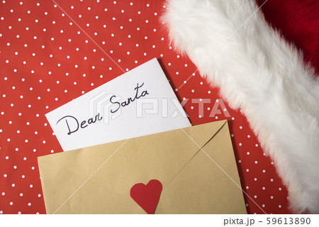 Letter for Santa in an envelope. Santa hat. Red Letter for Santa in an envelope. Santa hat. Red 59613890