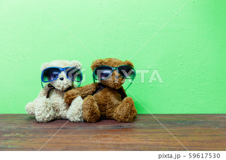 Teddy bear on old wood green wall background 59617530