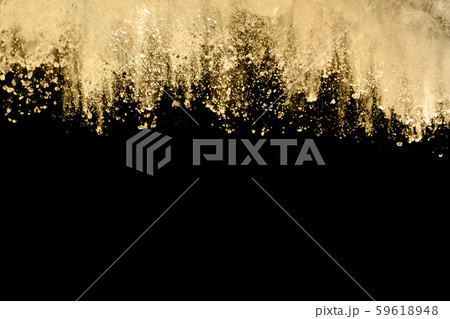 Golden powder explosion on black background. Freeze motion. 59618948
