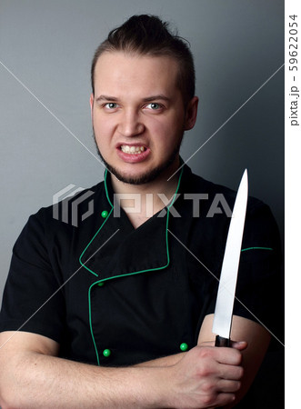 Angry chef with knife on gray Angry chef with knife on gray 59622054