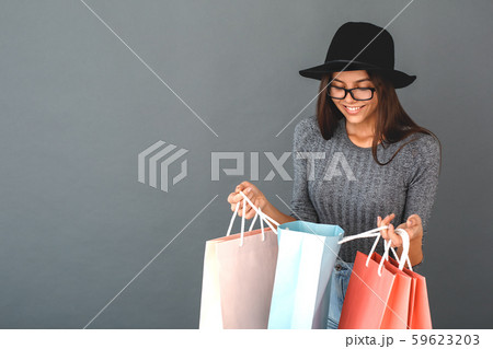 Young girl teenager isolated portrait shopping concept 59623203