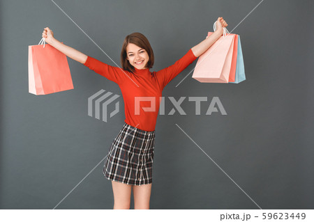 Young girl teenager isolated portrait shopping concept Young girl teenager isolated portrait shopping concept 59623449