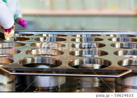 Making delicious cheese at a cheese factory 59624633