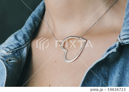 Tender jewerly on female neck, close up shot Tender jewerly on female neck, close up shot 59636723