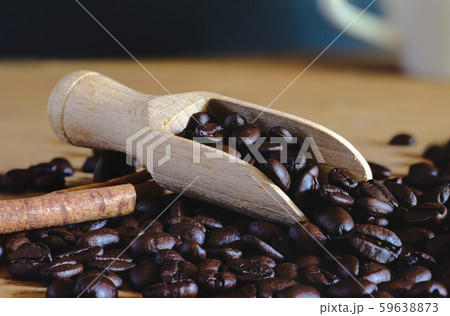 Roasters coffee bean in wood spoon on table. 59638873