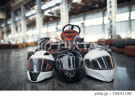 Go kart car and helmets on the ground, karting Go kart car and helmets on the ground, karting 59642186