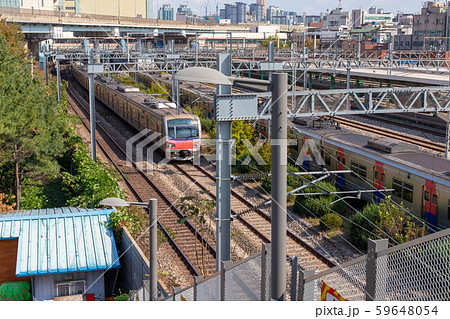 Railroad infrastructure and train passing by. Railway power supply system. Railway facilities 59648054