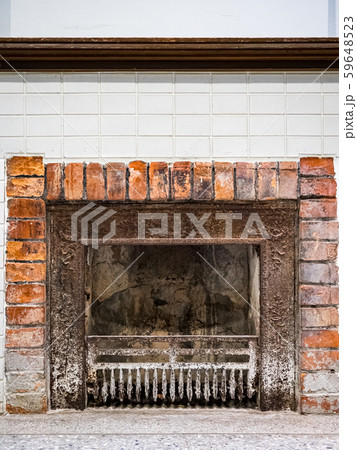 An old brick stove in a village house. An old brick stove in a village house. 59648523