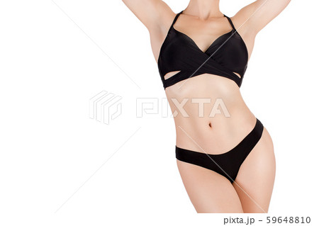 Female sexy fit cropped body in black sporty bikini, isolated on white Female sexy fit cropped body in black sporty bikini, isolated on white 59648810