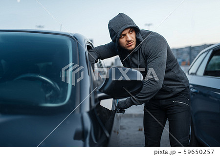 Car thief breaking door, criminal job, burglar Car thief breaking door, criminal job, burglar 59650257