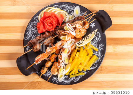 Assorted shrimp and shiitake mushrooms, mussels, and sweet potato. 59651010