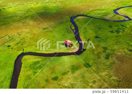 Iceland. Aerial view on the alone house, field and river. Landscape in the Iceland at the day time. Iceland. Aerial view on the alone house, field and river. Landscape in the Iceland at the day time. 59651411