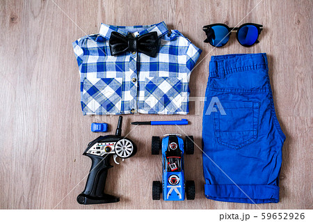 Stylish set of a little boy with dominant blue colors and accessories Stylish set of a little boy with dominant blue colors and accessories 59652926