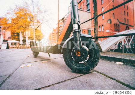 Close up of Electric kick scooter or e-scooter parked on pavement - e-mobility or micro-mobility 59654806