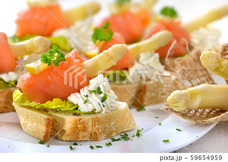 Canapes with German white asparagus, cream cheese and smoked salmon Canapes with German white asparagus, cream cheese and smoked salmon 59654959