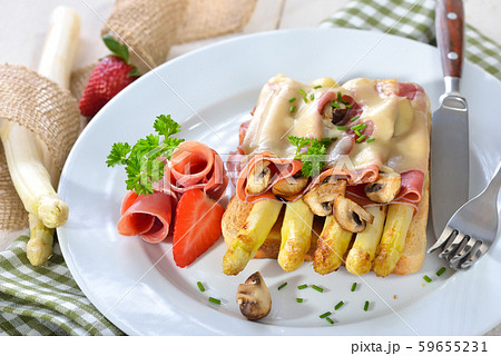 Toast with fried white asparagus, Spanish Serrano ham, mushrooms and melted cheese Toast with fried white asparagus, Spanish Serrano ham, mushrooms and melted cheese 59655231
