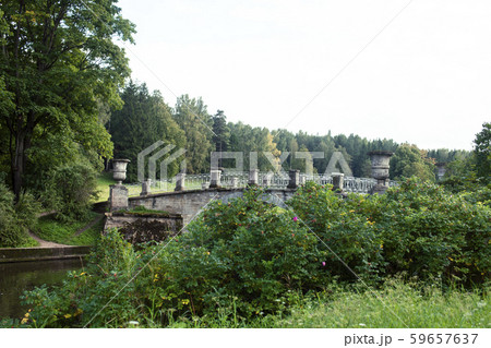 old vintage bridge on river in green park, landscape historical 59657637