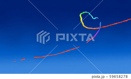 虹色のハートマークの飛行機雲と青空背景イメージ素材のイラスト素材