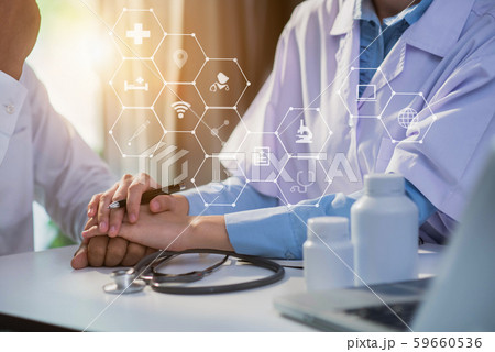 Friendly female doctor hands holding patient hand sitting at the desk for encouragement, empathy, cheering and support while medical examination. Friendly female doctor hands holding patient hand sitting at the desk for encouragement, empathy, cheering and support while medical examination. 59660536