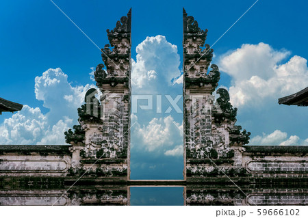 Young couple standing in temple gates  59666102