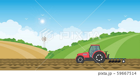 Farmer driving a tractor in farmed land on rural 59667514
