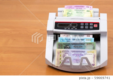 Money from Bangladesh in a counting machine Money from Bangladesh in a counting machine 59669741