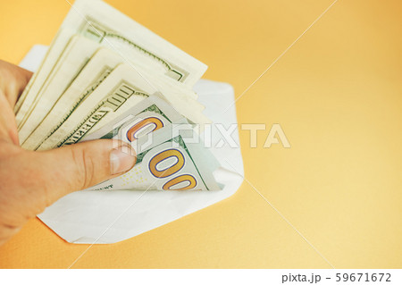 Close up Beautiful Dollars in the envelope on a Close up Beautiful Dollars in the envelope on a 59671672