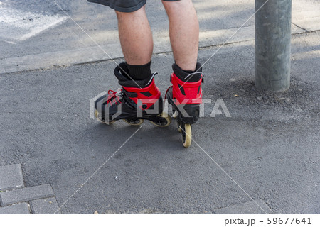 Close-up legs of teenagers riding roller skating Close-up legs of teenagers riding roller skating 59677641
