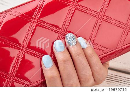 Red clutch and blue manicure. Red clutch and blue manicure. 59679756