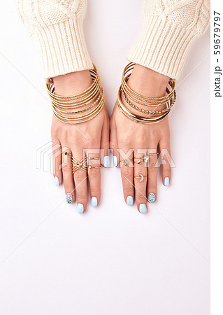 Many different bracelets and rings on hands. Many different bracelets and rings on hands. 59679797
