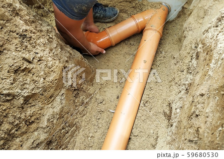 A locksmith supplies a sewer pipe to the sump. 59680530
