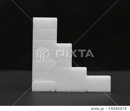 white sugar cubes stacked in a pyramid, sugar white sugar cubes stacked in a pyramid, sugar 59680878