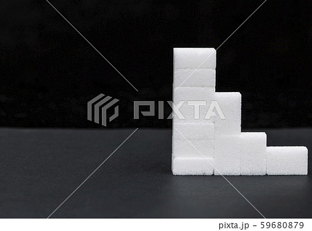 white sugar cubes stacked in a pyramid, sugar 59680879
