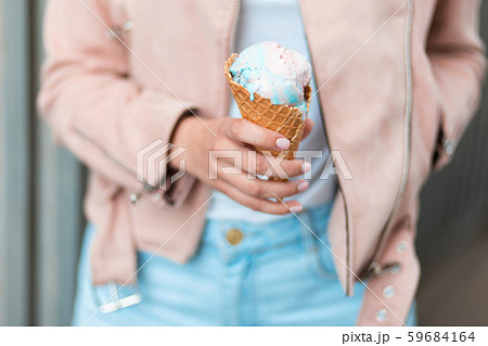 Beautiful woman holding ice cream. Beautiful woman holding ice cream. 59684164