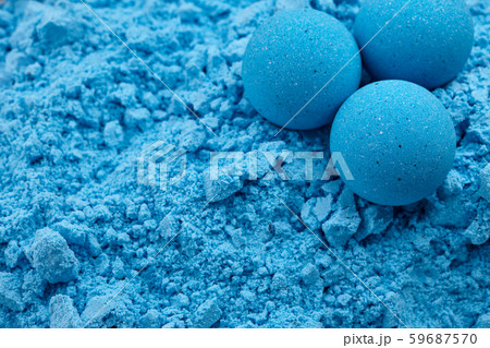 Blue bath bombs on dry mixture background 59687570