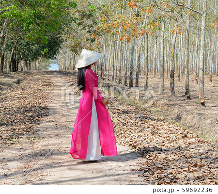 An Asian in traditional dress (Ao Dai) An Asian in traditional dress (Ao Dai) 59692236