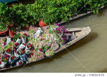 Wooden boats carrying flowers Wooden boats carrying flowers 59692420
