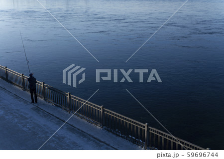 Man fishing in blue river, landscape photography Man fishing in blue river, landscape photography 59696744