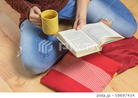 Aerial view of woman sitting down on the floor Aerial view of woman sitting down on the floor 59697434