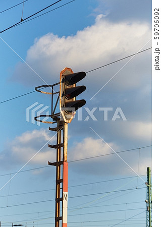 Railway signal light on a rusty post Railway signal light on a rusty post 59706092