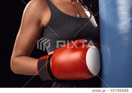 Boxing. Woman boxer in gloves exercise with punching bag hit close-up Boxing. Woman boxer in gloves exercise with punching bag hit close-up 59706896