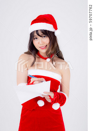 Beautiful portrait young asian woman writing notepad in xmas day isolated on white background Beautiful portrait young asian woman writing notepad in xmas day isolated on white background 59707762