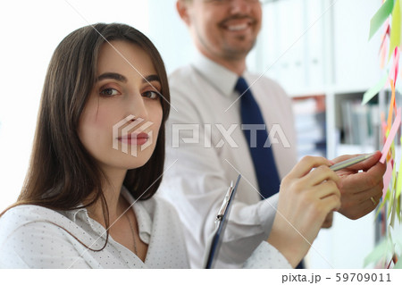 Pretty female colleague in office 59709011